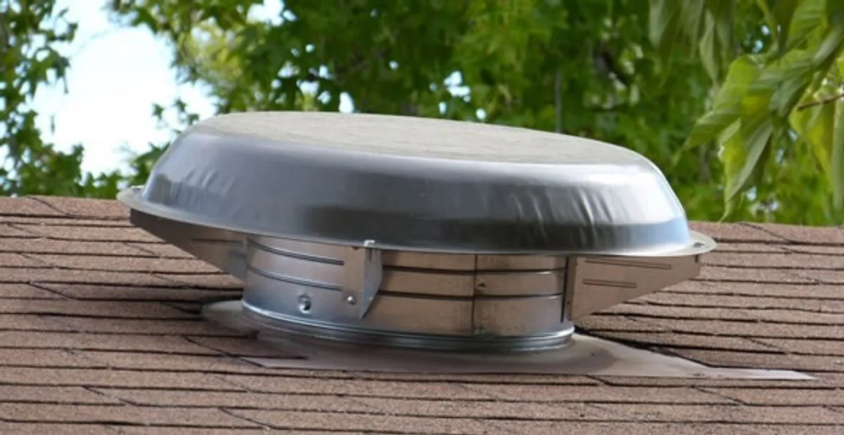 attic fan installation services with low-profile roof ventilation unit in Sarasota, FL